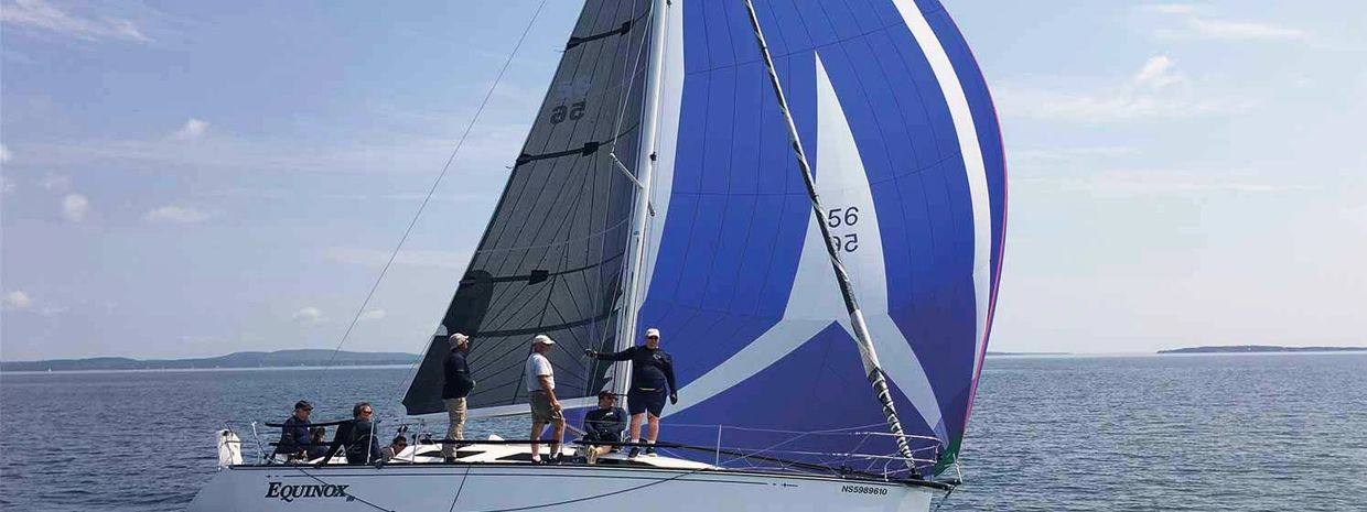 Crew sailing in ocean