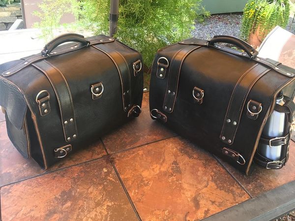 Black leather saddle bags with custom buckles and hardwear