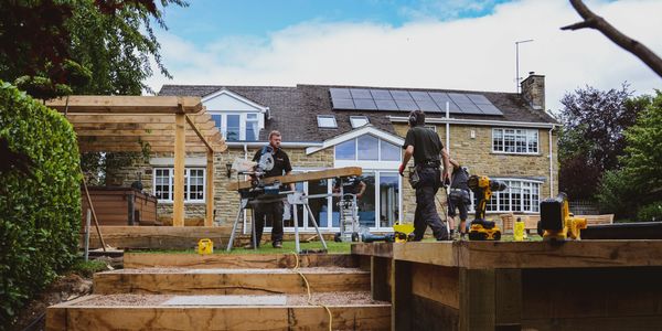 Bowe Joinery & Developments team building an oak pergola and raised fire pit.