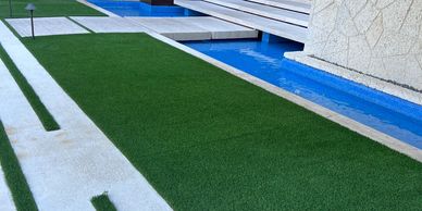 artificial grass around pool area edging borders on concrete deck