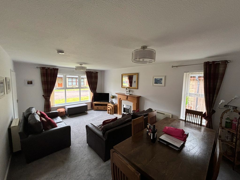 Living room and dining area. The table comfortably seats 6 and is great for board games!