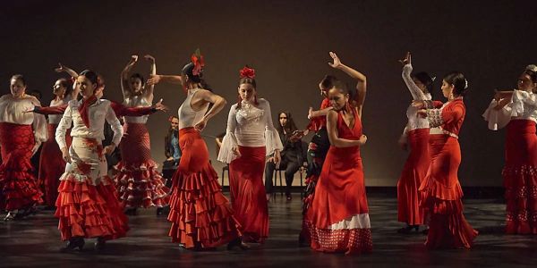 Group performing traditional flamenco dance.