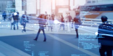 Blurred people walking in a city with digital data overlays.