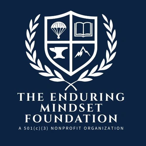 Logo of The Enduring Mindset Foundation with symbolic icons and laurel wreath.