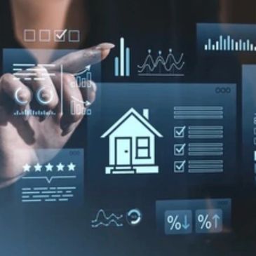Hand interacting with virtual real estate and data analytics interface.