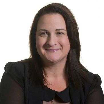 Smiling woman with straight dark hair in black clothing.