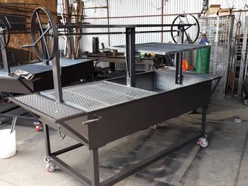 this one is a 72 x 36 santa maria grill and has a fold down front and a  dual lift system. 