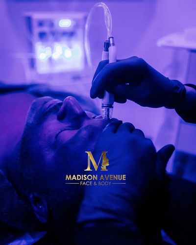 Diamondglow facial being done on male patient at madison avenue face and body in new york city