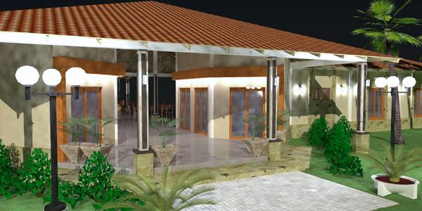 A modern house with a tiled roof and outdoor lighting at night.