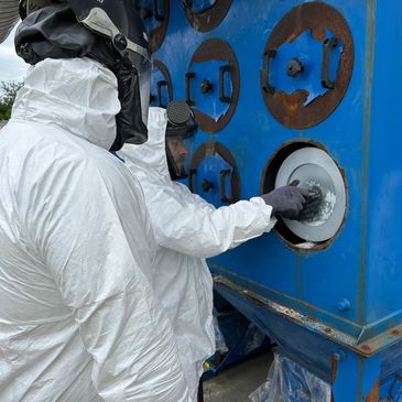 Changing cartridge filters on a hazardous dust application ensuring the workforce are suitably prote