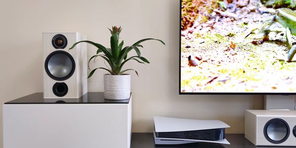 audio, music, flat screen tv wall mounted with playstation 5 and surround sound speakers 