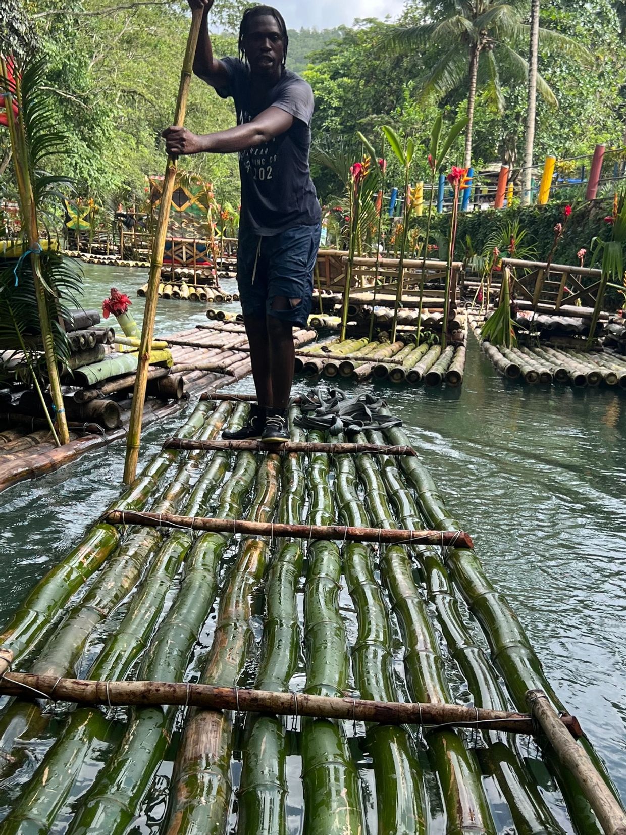 Tour guide “Shrimpy” bamboo rafting on the Great River. So relaxing and serene! 