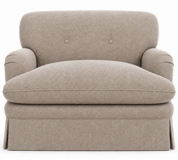 Cozy beige armchair with soft cushions and rounded arms.