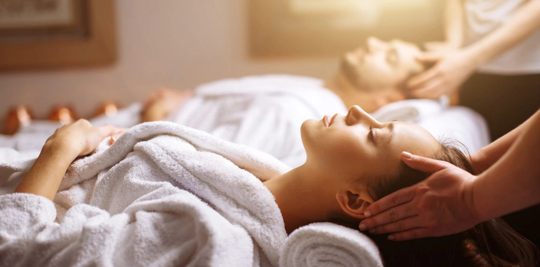 Enjoying a couples massage side by side in a couple's suite at The Retreat in Valparaiso, Indiana