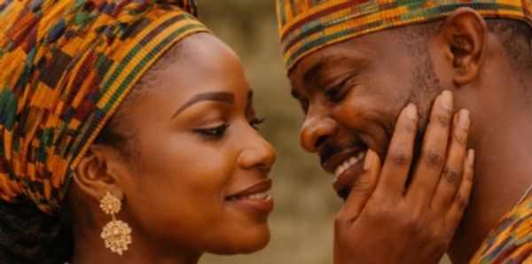 A vibrant landscape featuring mountains, a clear blue sky, and a serene lake reflecting the scenery.