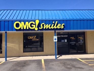 Channel letters with logo sign, Omg! Smiles dentist in strip mall. Worcester, MA