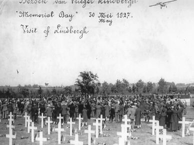 Charles Lindbergh drops a bouquet of flowers on the Flanders Field American cemetery in Belgium in 1