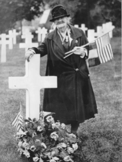 Catherine Gorman stands at the grave of her son, Vincent, at the Suresnes American cemetery in Franc