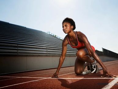 Athlete preparing to start a race on the track.