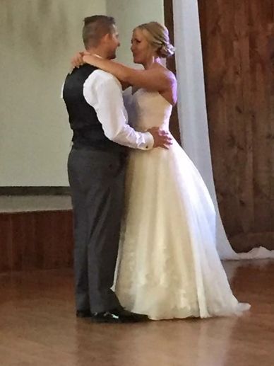Wedding dance she is holding him