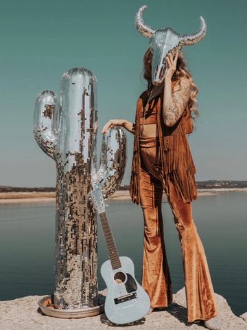 large disco cactus prop with disco guitar