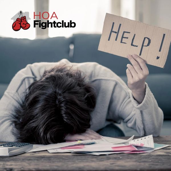 Person overwhelmed with bills holding a 'Help!' sign, symbolizing financial stress.