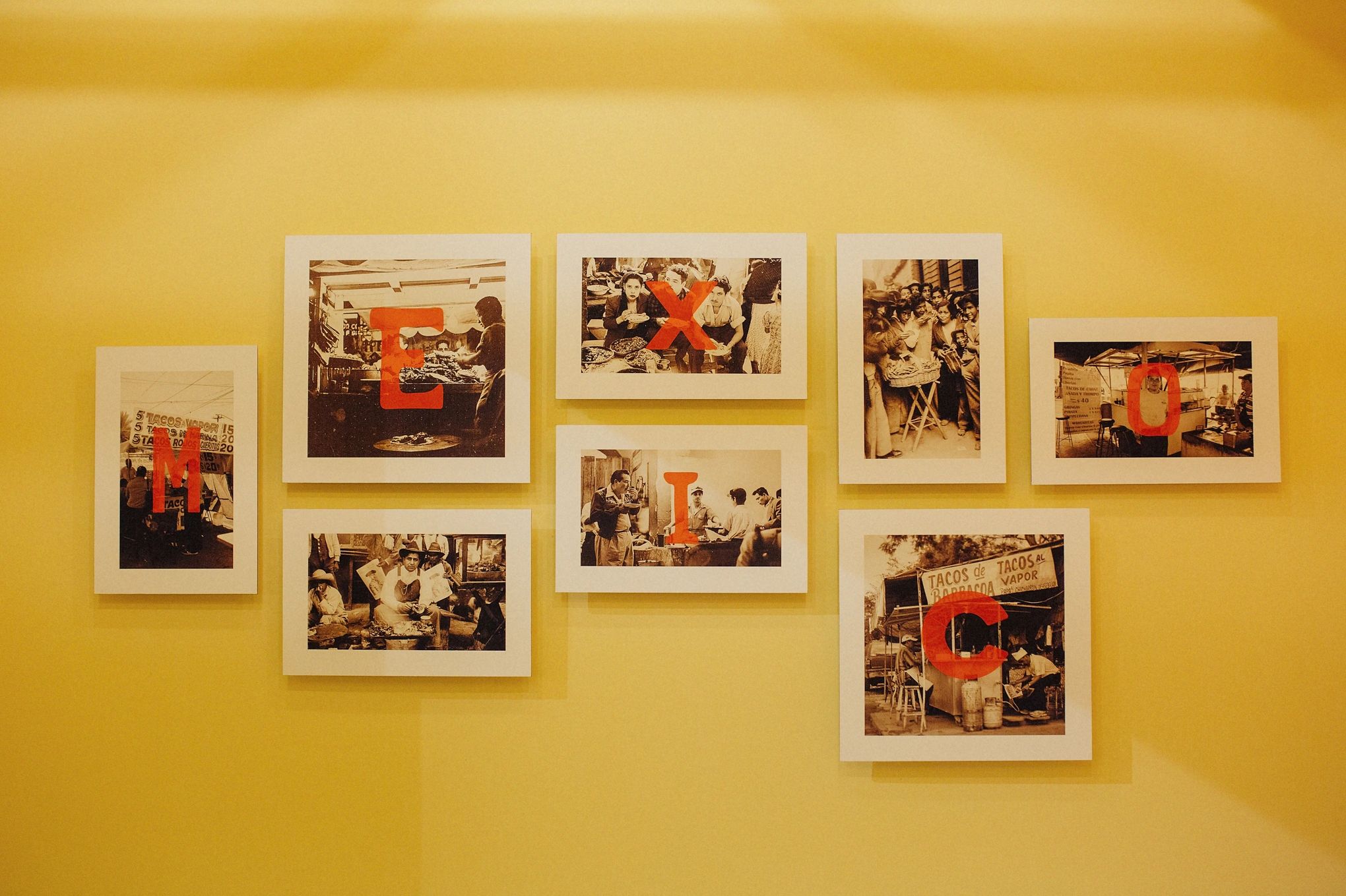 Vintage photos on a yellow wall spell out 'MEXICO' with red letters.