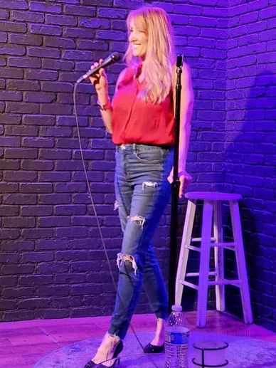 Rebecca Keissling doing standup comedy.