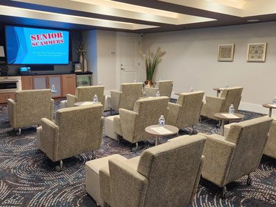 Senior gamers meeting room setup with comfortable chairs.