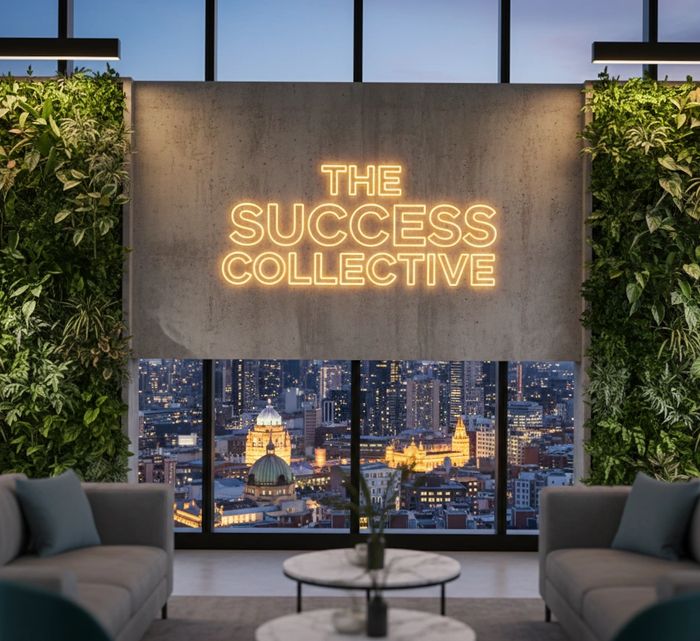 Modern office lounge with neon sign and city view.