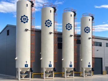 Four tall industrial storage tanks labeled 1 to 4.