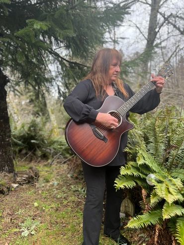 Barbara Anne with her guitar