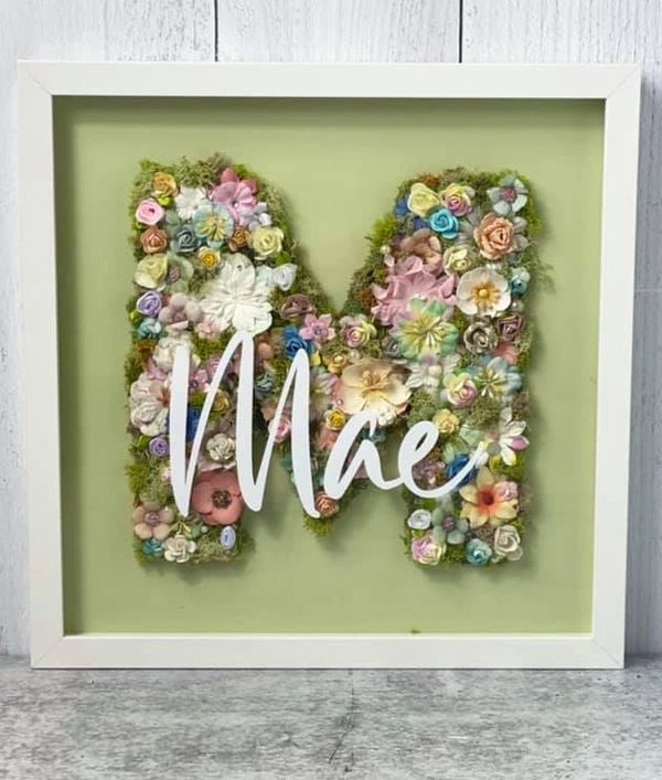 garden theme pastel floral and preserved moss letter M sign