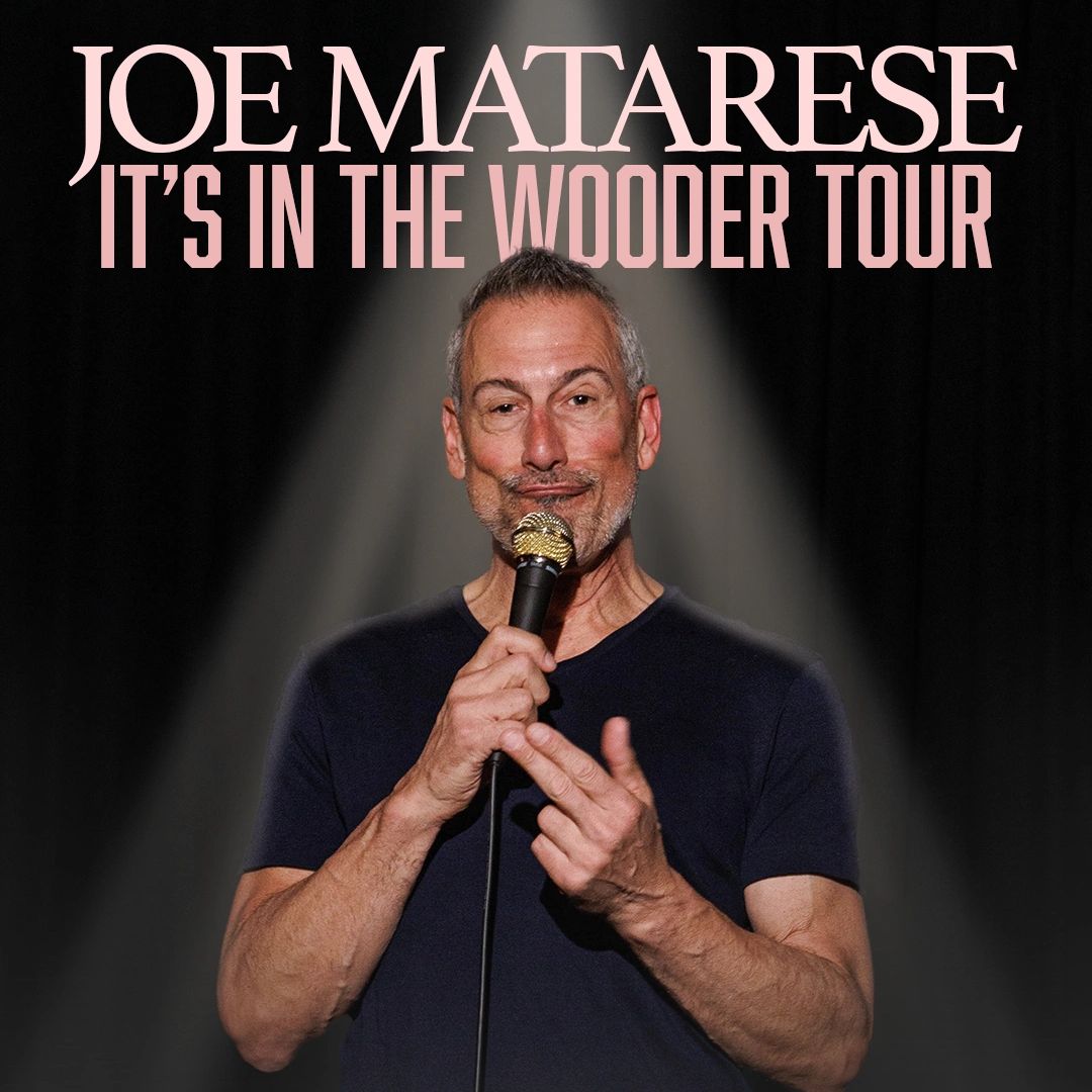 Comedian Joe Matarese on stage with microphone for It's In The Wooder Tour.