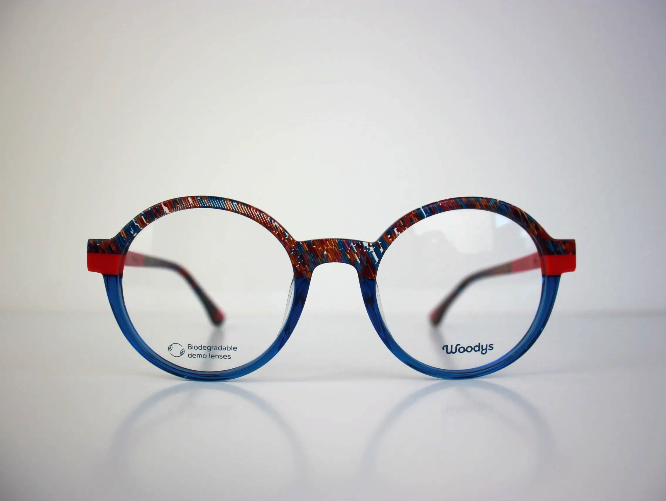 Colorful round eyeglasses with biodegradable demo lenses.