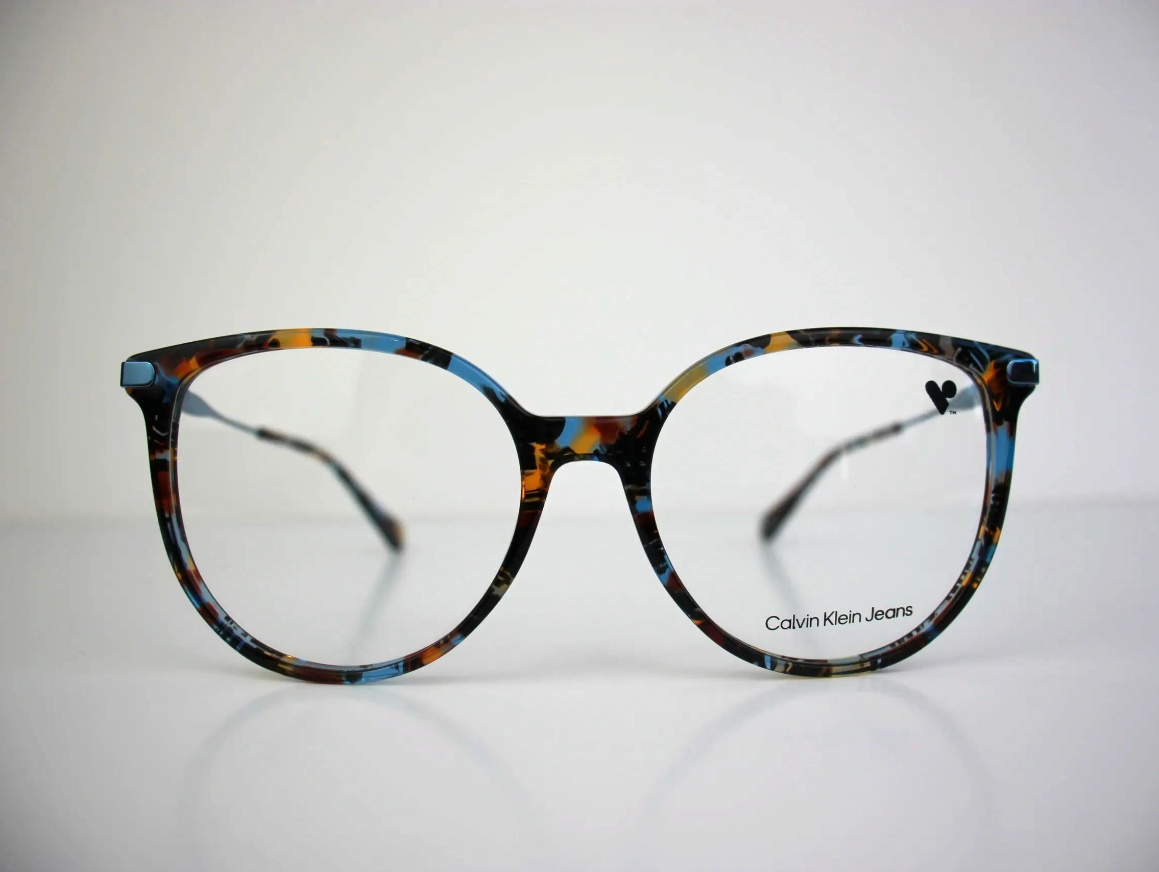 Colorful Calvin Klein Jeans eyeglasses with a tortoiseshell pattern.