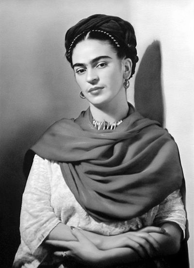 Black and white portrait of a woman with braided hair and a shawl.
