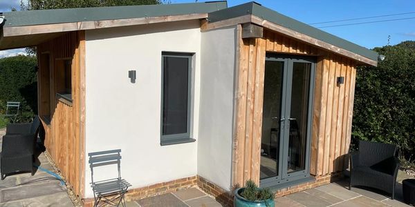Hemp garden room outbuilding with lime render and timber cladding 