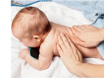 Baby being treated. Treating tiny humans with the best physiotherapy in Oakville.