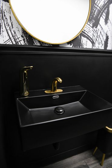 Black Vessel Sink with Gold Faucet and Soap Dispenser