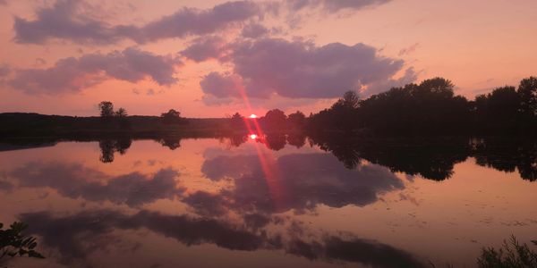 Pink and purple sunset reflecting on the lake at Chippewa Valley Campgrounds
