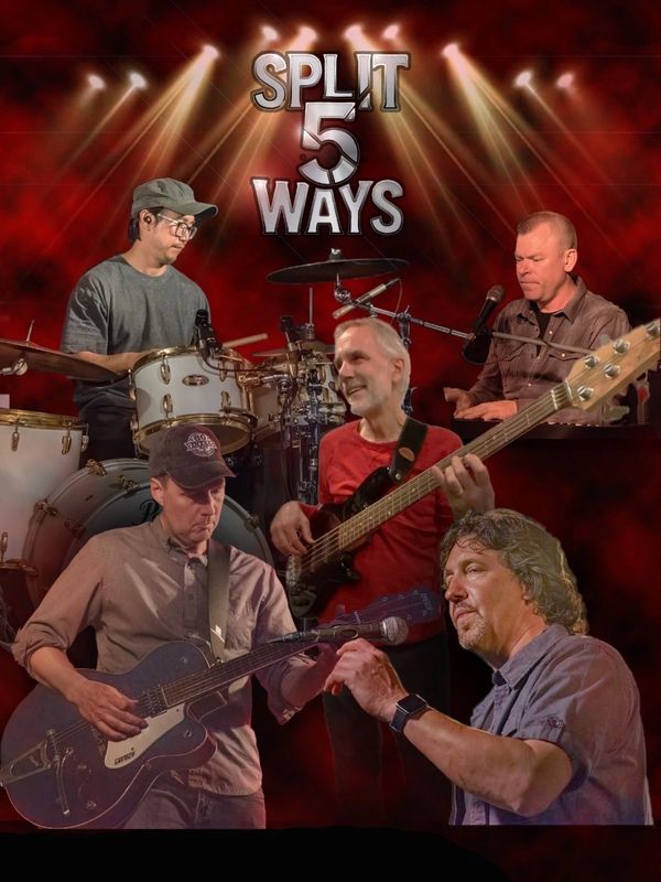 Split 5 Ways band performing with instruments under dramatic lighting.