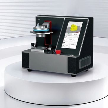 Compact 3D dental scanner on white pedestal.