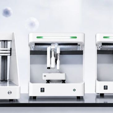 Modern white 3D printers on a clean surface.