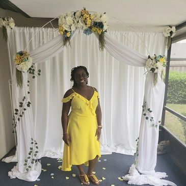 Pipe and draping, white metal arch, silk flowers, floral arrangement