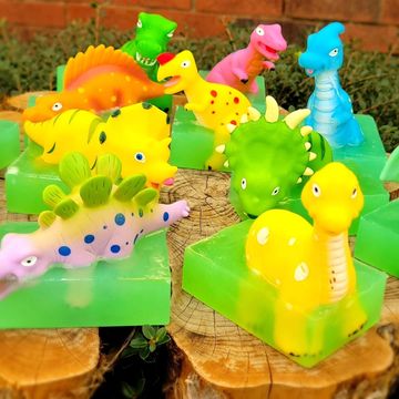 Bubblegum scented dinosaur soap. Green glycerin with dinosaur bath squirter toy.
