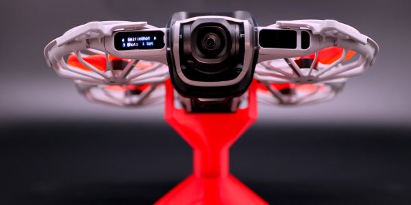 Front view of a drone with camera and digital display.