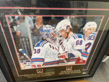 Henrik Lundqvist and Jaromir Jagr celebrate in a New York Rangers photo.