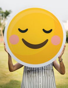 https://www.pexels.com/photo/person-holding-round-smiling-emoji-board-photo-1282169/