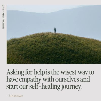 Person standing alone on a grassy hill with motivational text about empathy and self-healing.